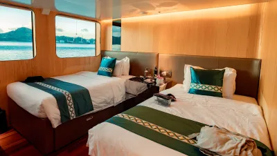 Seaview cabin on Black Pearl with two single beds and sea view windows