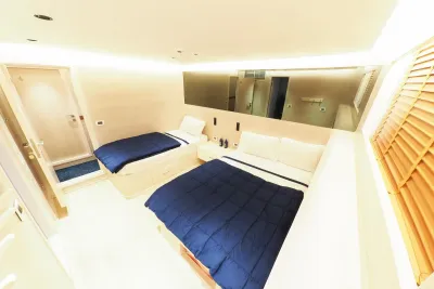 Double cabin on the lower deck of Blue Force Three — double and single beds