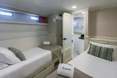 Deluxe Stateroom on the lower deck of Galapagos Sky — two single beds