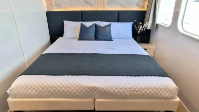 Upper deck cabin on Galaxy Diver II — double bed and marble headboard