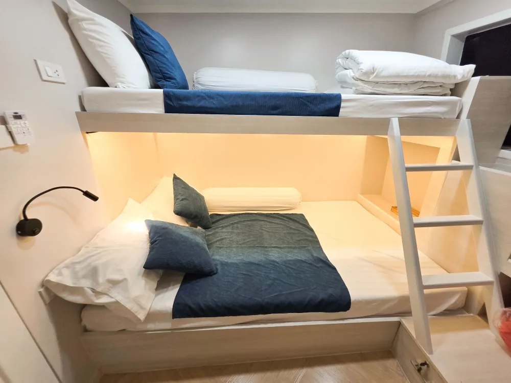 Wide lower berth and upper bunk in cabin B2 on Krishna 3