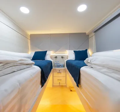 Cabin A3 on Krishna 3 — two single beds with a table between them
