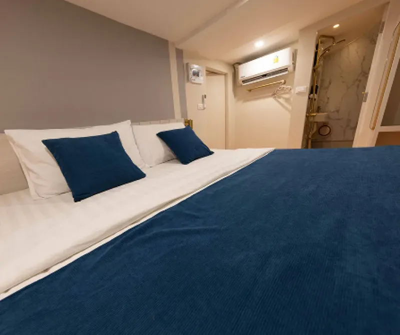 Headboard of the Krishna 3 master cabin bed and the entrance to the shower