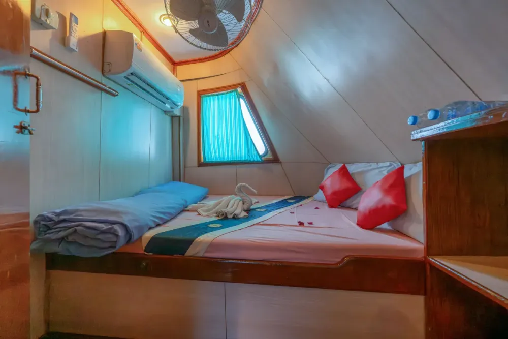 Double bed in a bow cabin of Manta Queen 2