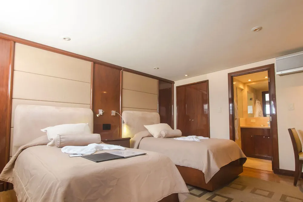 Suite No. 2 on Okeanos Aggressor II — twin beds and the bathroom door