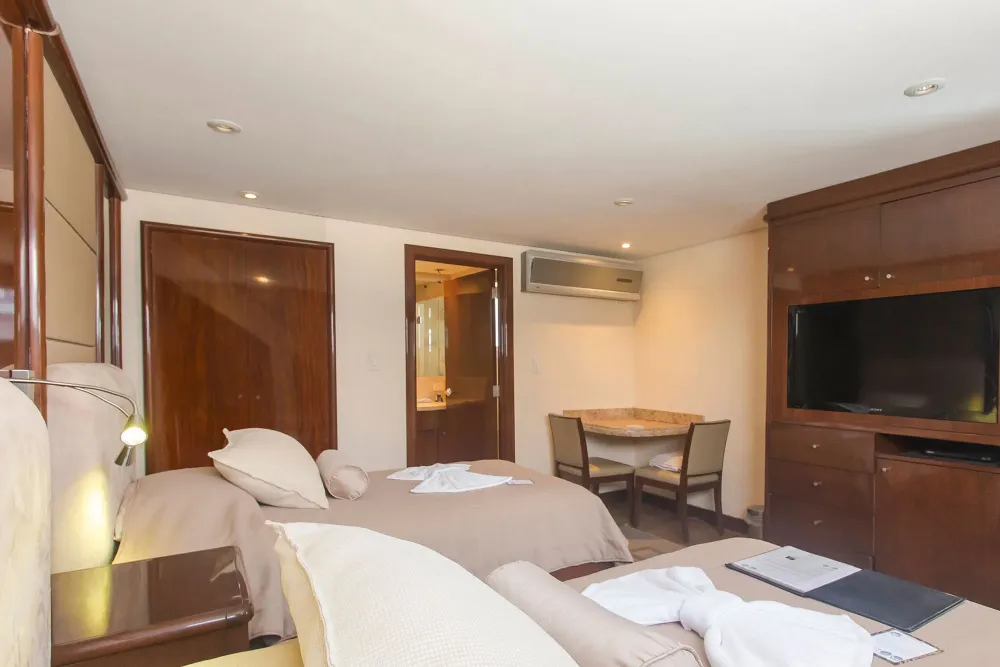 Suite No. 2 on Okeanos Aggressor II — television, table and chairs