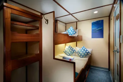 Classic Twin/Double cabin on Pacific Master — lower bed with a bunk above