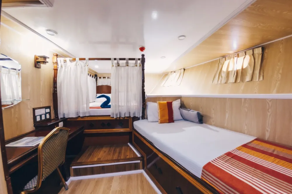 Triple cabin on Princess Dhonkamana — a double bed and a third single bed