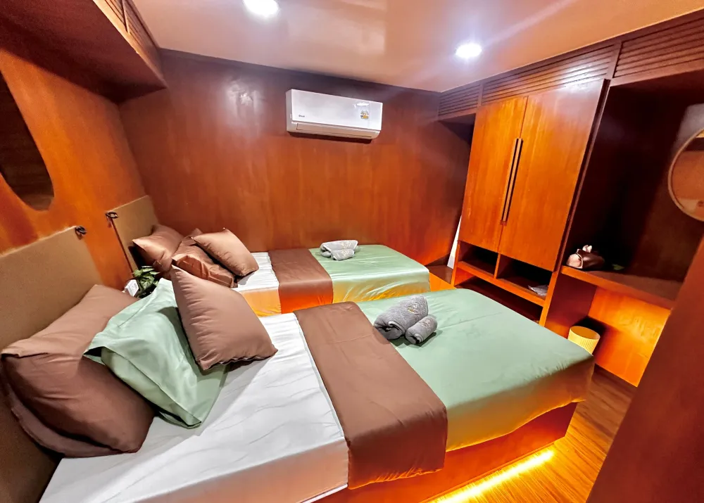 Raga lower deck cabin with two single beds and a wardrobe