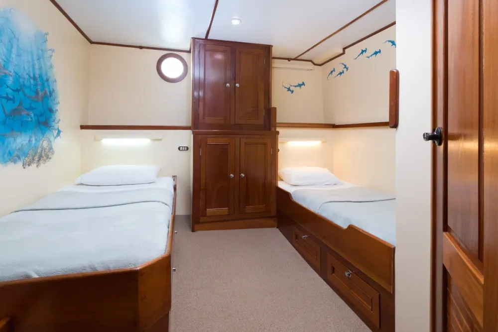 The same cabin made up as two separate single beds