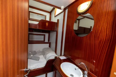 Category A double cabin on Sea Pearl with the bed made up