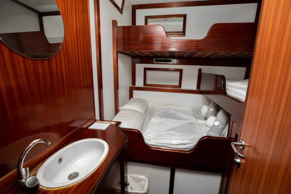 Category A triple cabin on Sea Pearl with a double bed and upper bunk