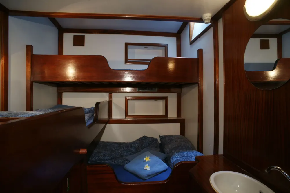 Category A cabin on Sea Pearl, mahogany panelling and wash basin