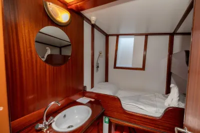 Category B cabin on Sea Pearl, berth against the bulkhead and wash basin