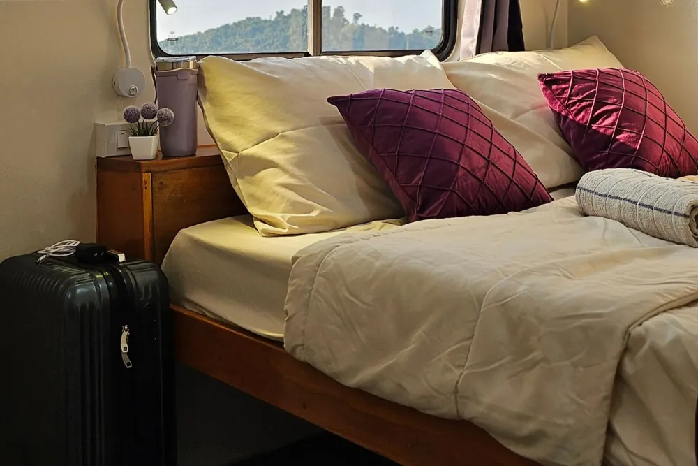 Headboard and bedside table in a main deck cabin