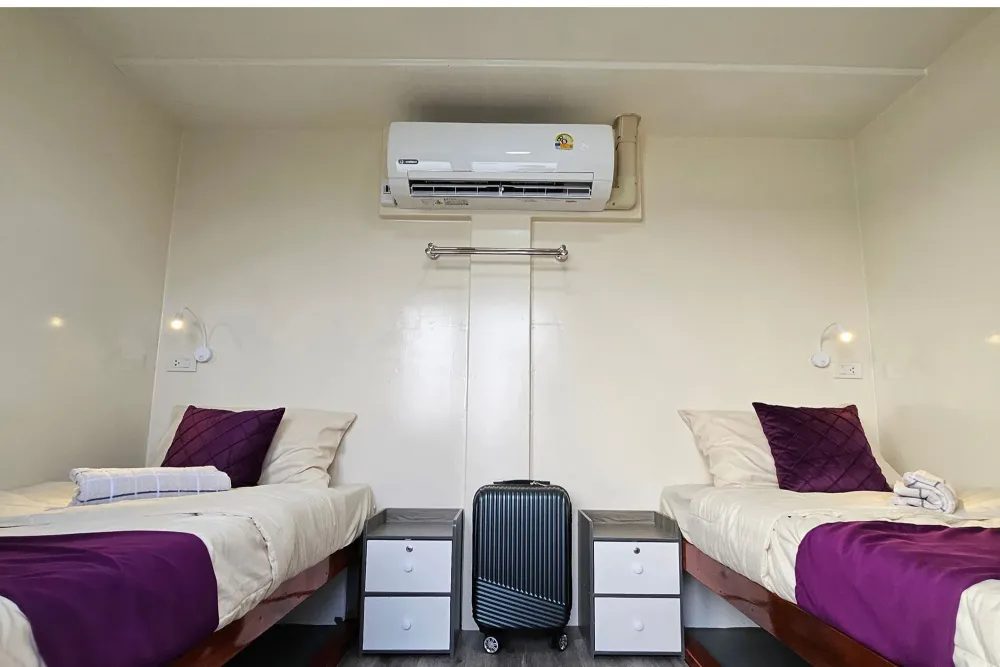Twin cabin on Seatopia with two single beds and air conditioning