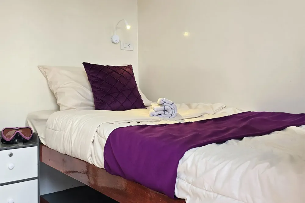 Single bed in an upper deck cabin on Seatopia