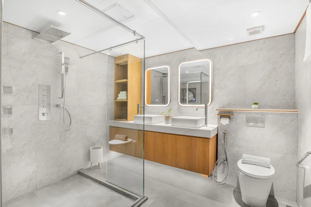 Lower deck cabin bathroom on Solitude Gaia with a shower cubicle