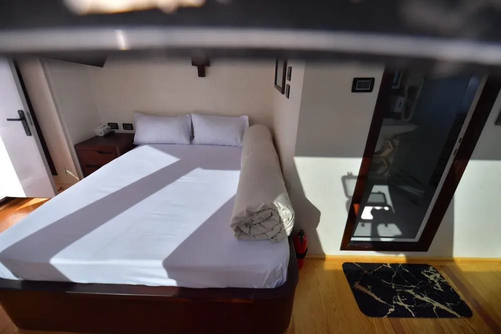 Suite — the made-up bed and the entrance to the bathroom