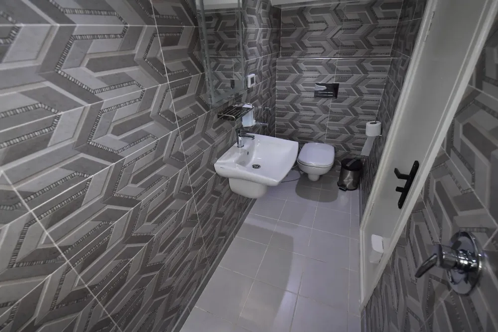 En-suite bathroom of a lower deck cabin with basin and shower