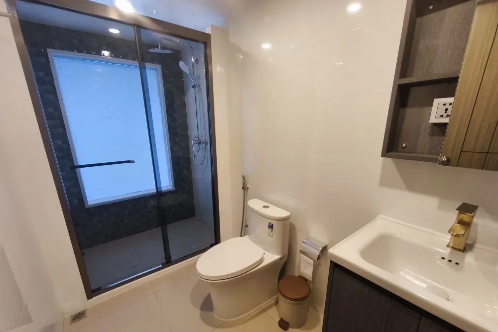 Upper deck suite bathroom on Spirit of Maldives with a shower cabin