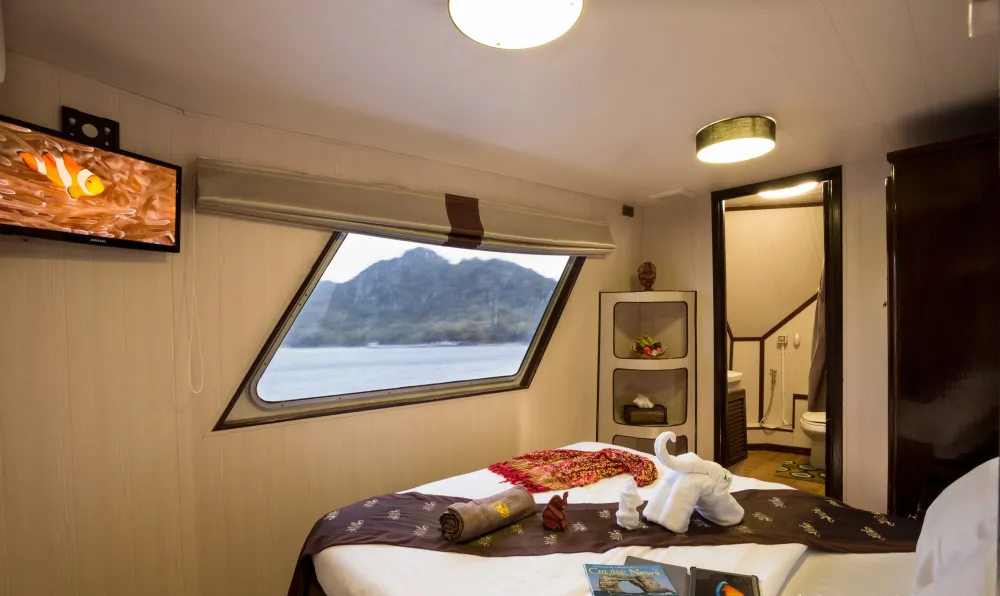 Master stateroom on Thailand Aggressor — picture window looking out on the islands