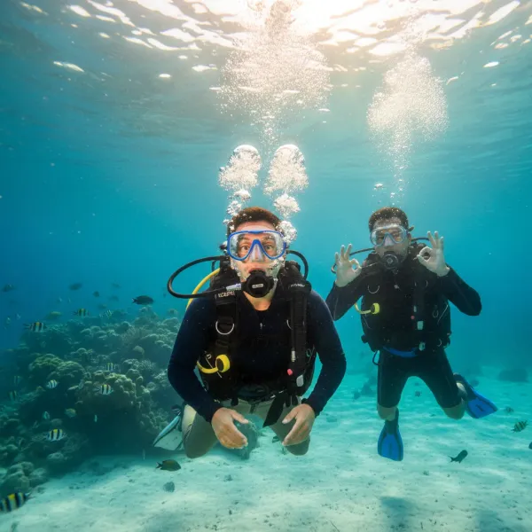 A diver takes their first breath underwater
