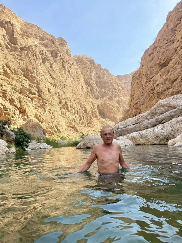 Swimming in a mountain canyon — crystal water between rocks