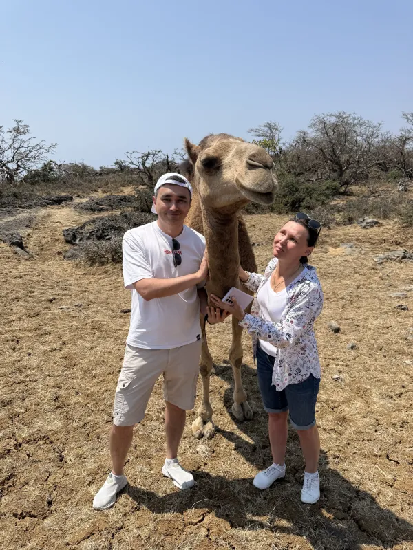 Couple with a camel in the Dhofar desert