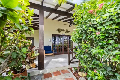 The bungalow entrance among the greenery