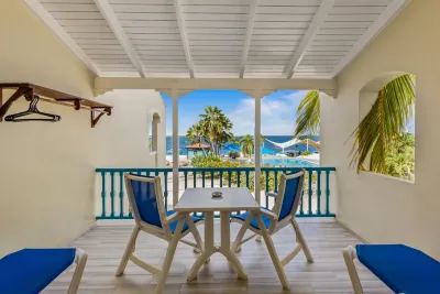 A veranda with a table and a sea view