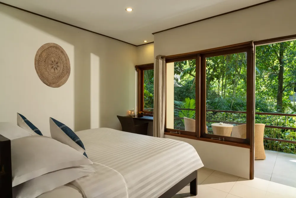 Garden View Room bedroom with a window onto the greenery