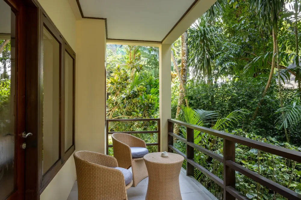 Garden View Room veranda with rattan chairs