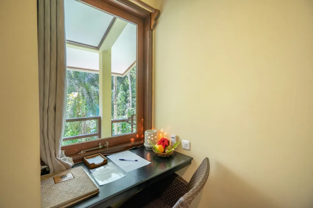 Work desk by the window in a Garden View Room