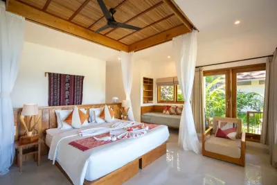 Bedroom with mosquito nets and an ocean view