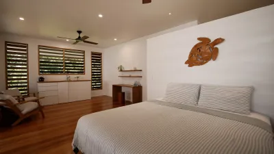 Beach house bedroom with timber finishes