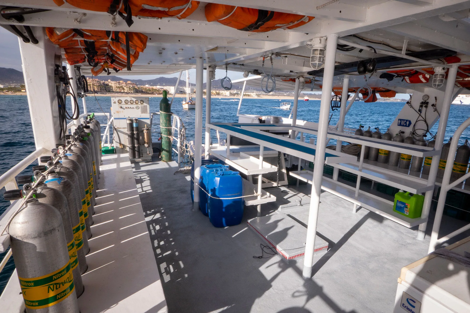 Dive deck of Adventure with tanks in racks and space to kit up