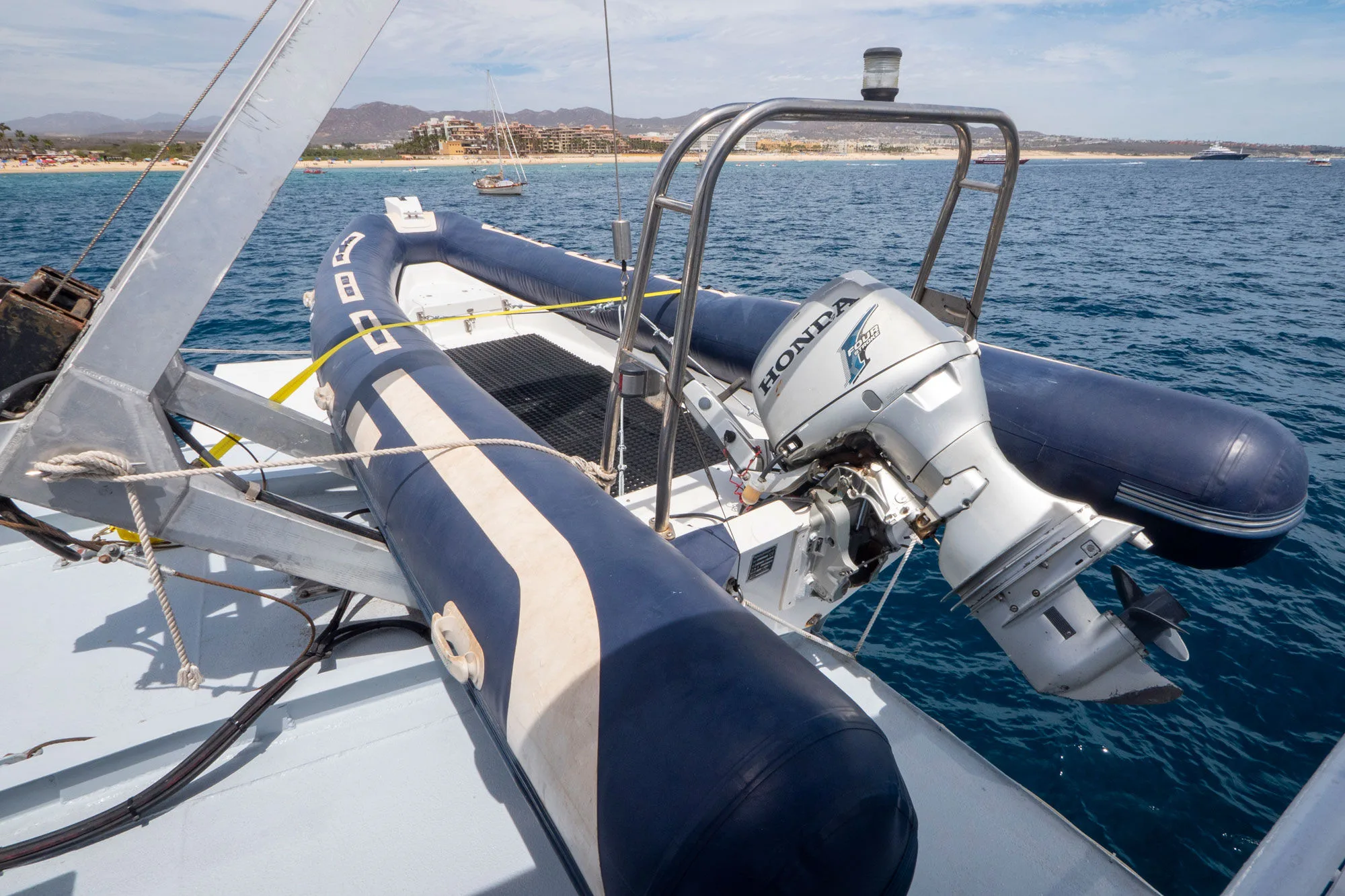 Adventure's tender with outboard motor stowed on the aft platform