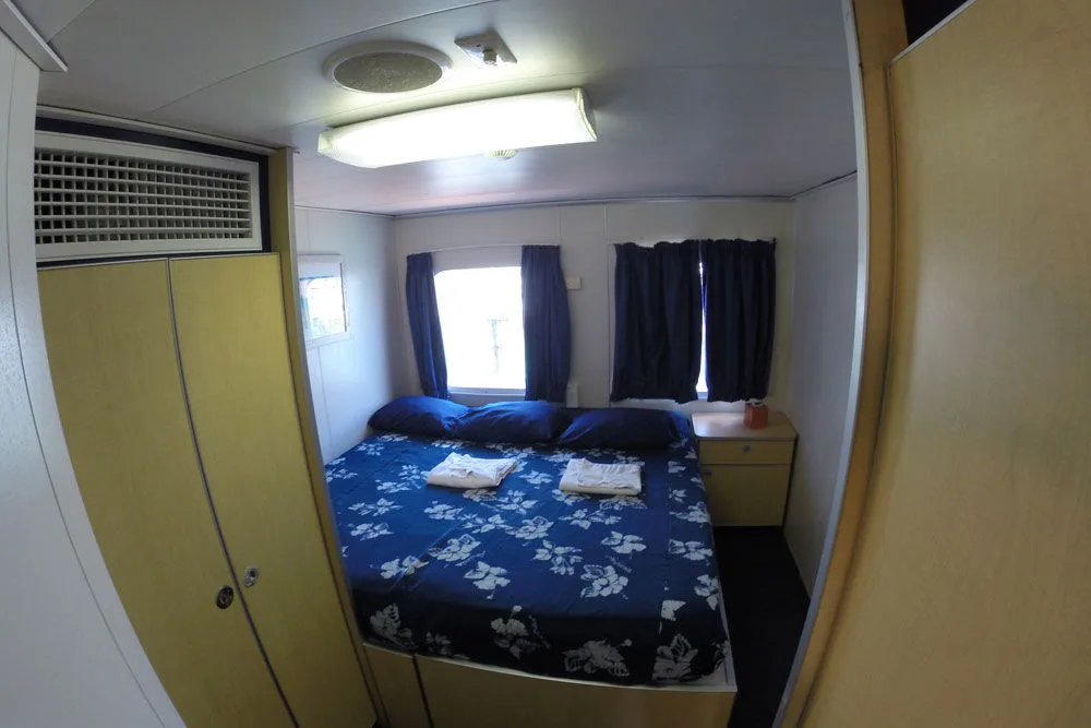 King cabin on the All Star Aqua Cat with air conditioning and wardrobe