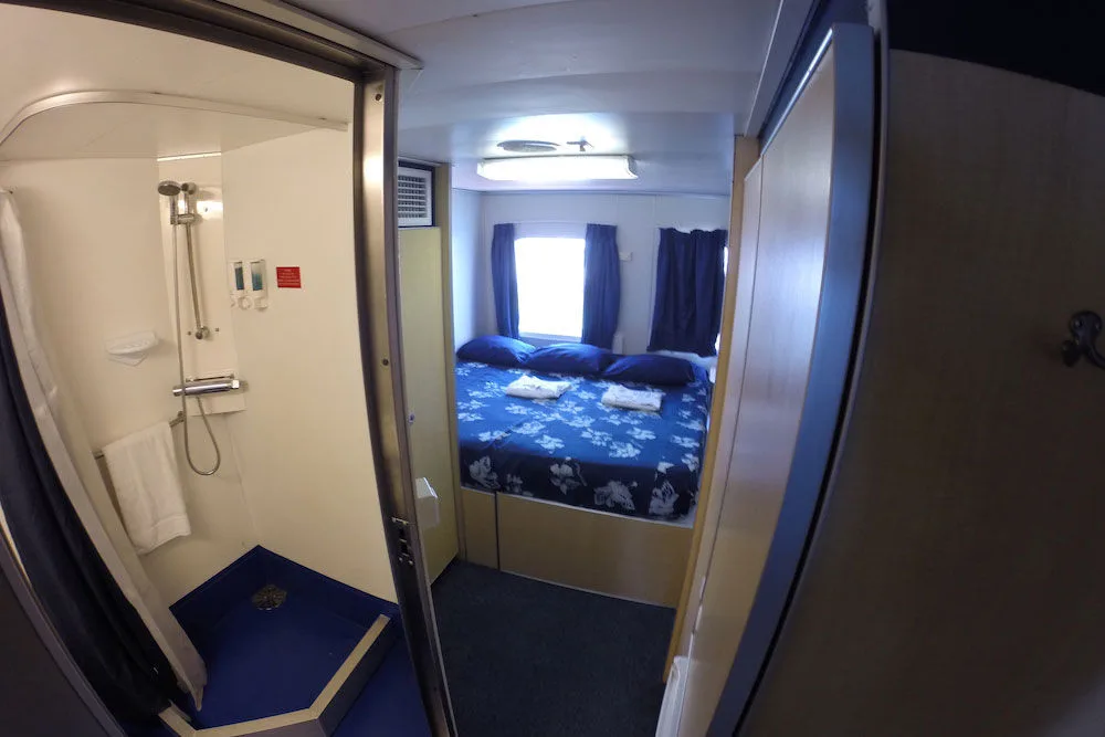 King cabin on the All Star Aqua Cat with the shower next to the sleeping area