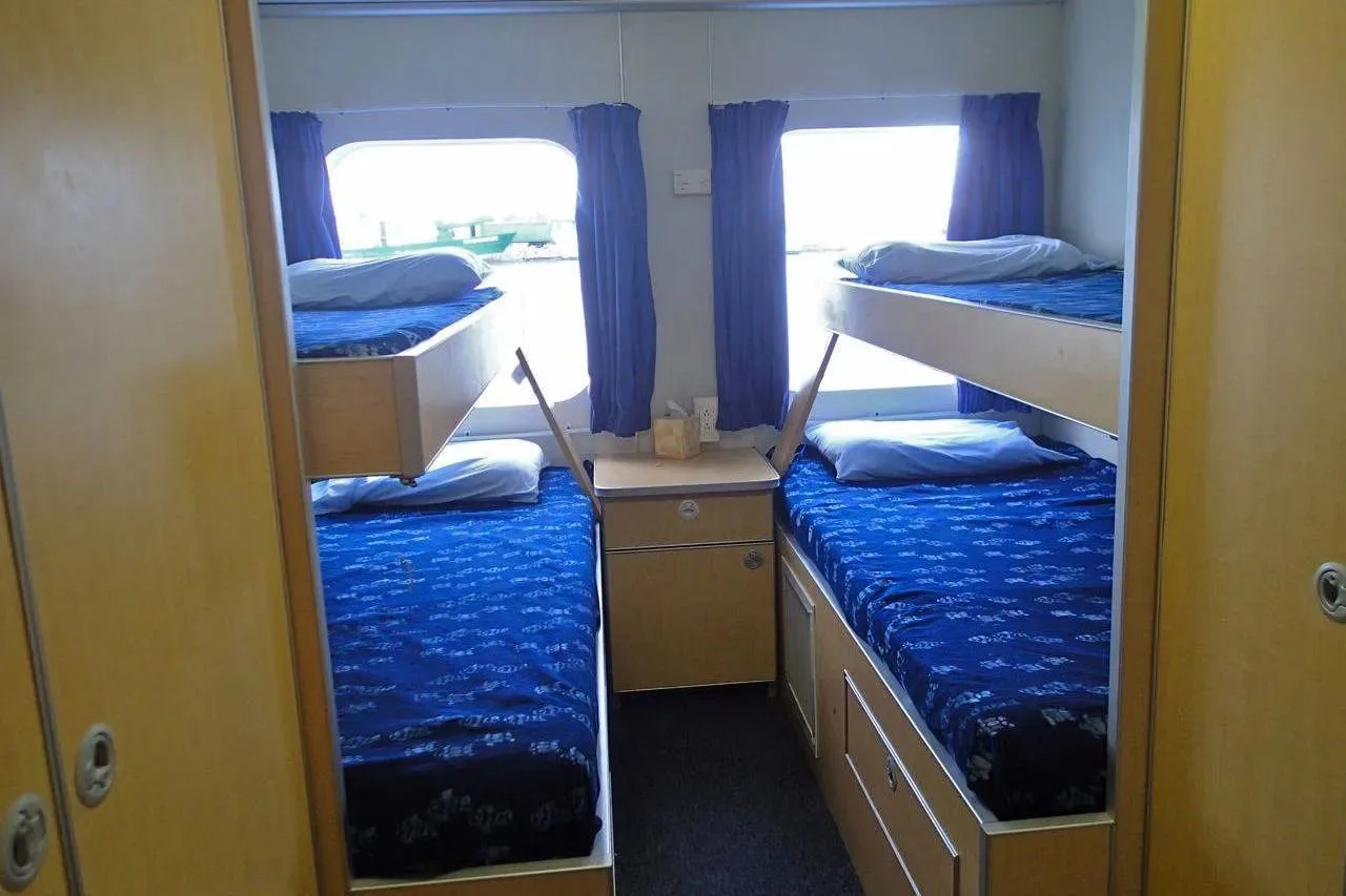 All Star Aqua Cat cabin for four with two lower beds and two pull-down berths