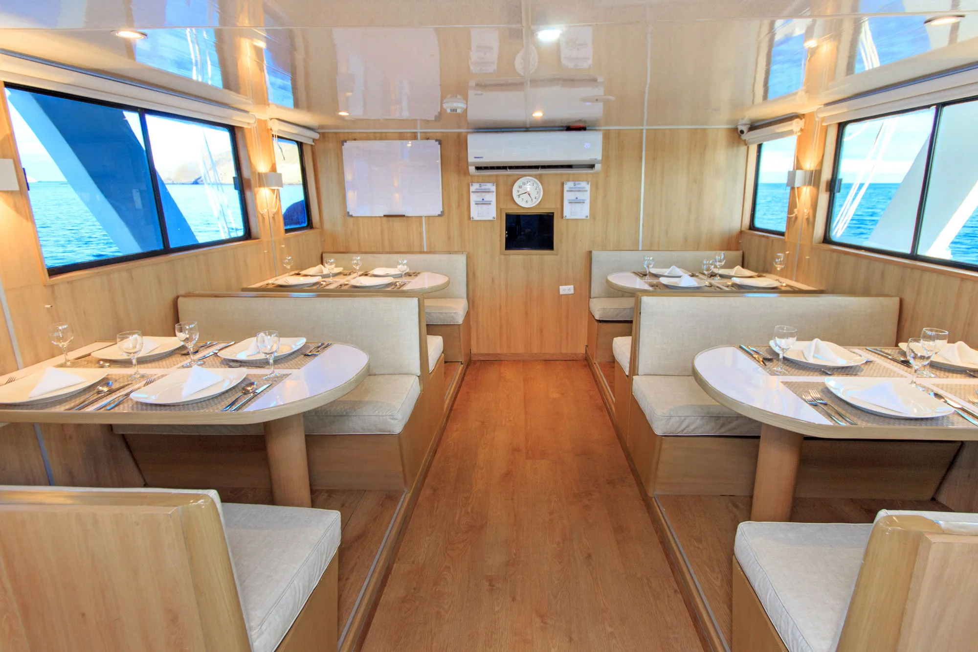 Dining room on Aqua with tables laid