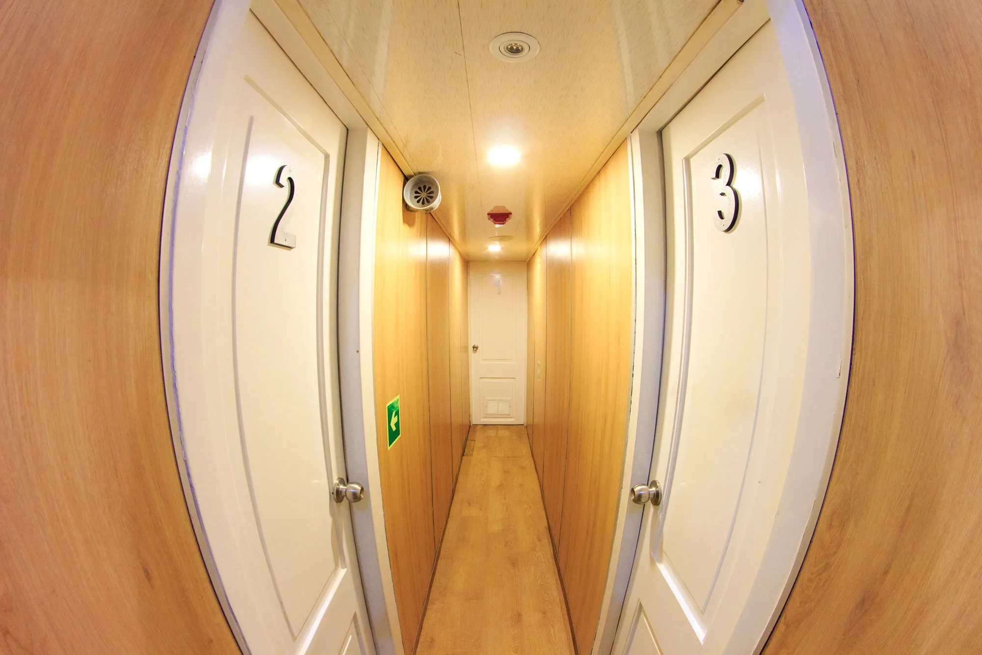 Lower deck corridor on Aqua with cabin doors