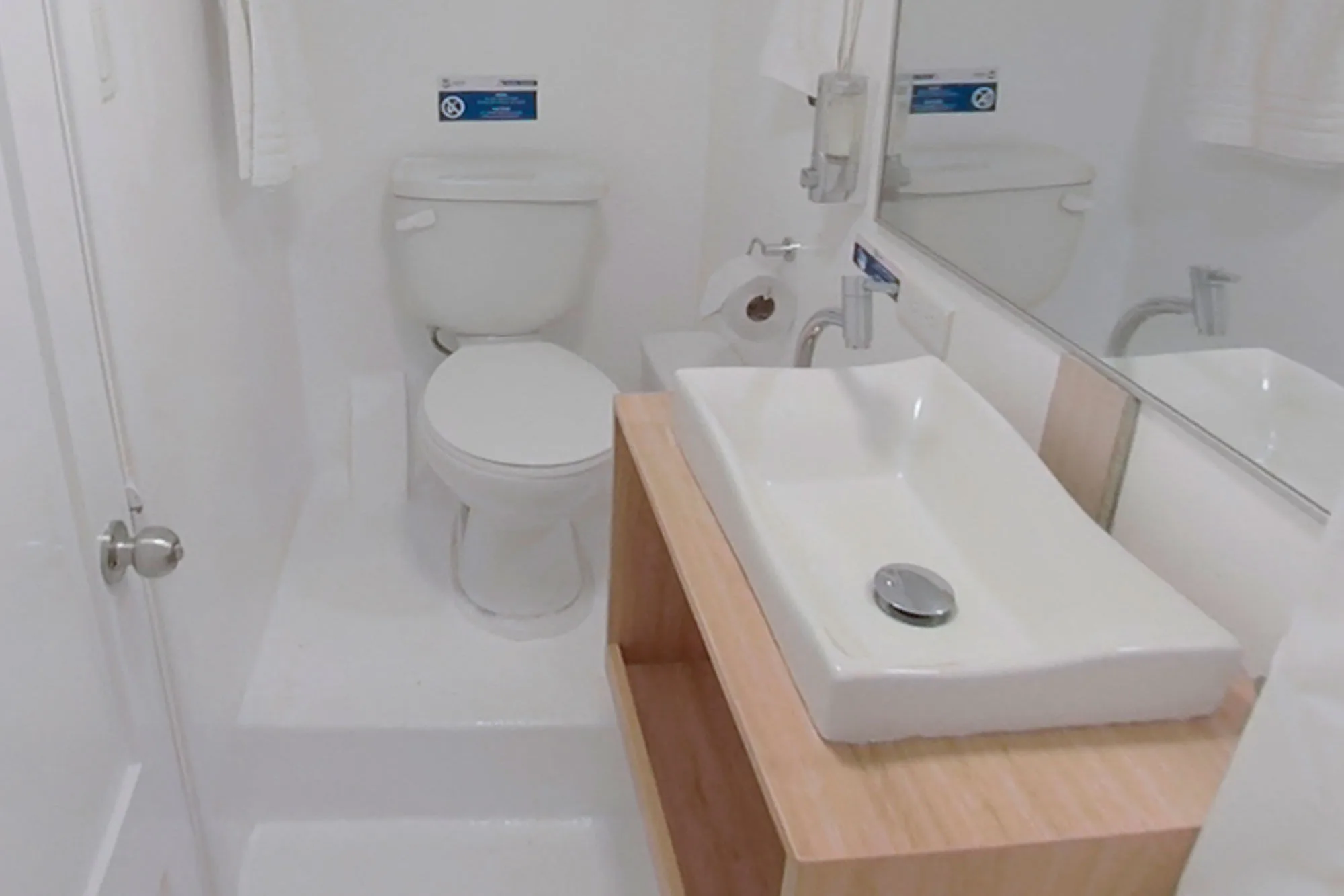 Cabin bathroom on Aqua with shower and basin