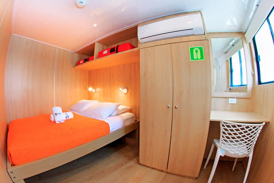 Main deck cabin on Aqua — double bed, closet and desk