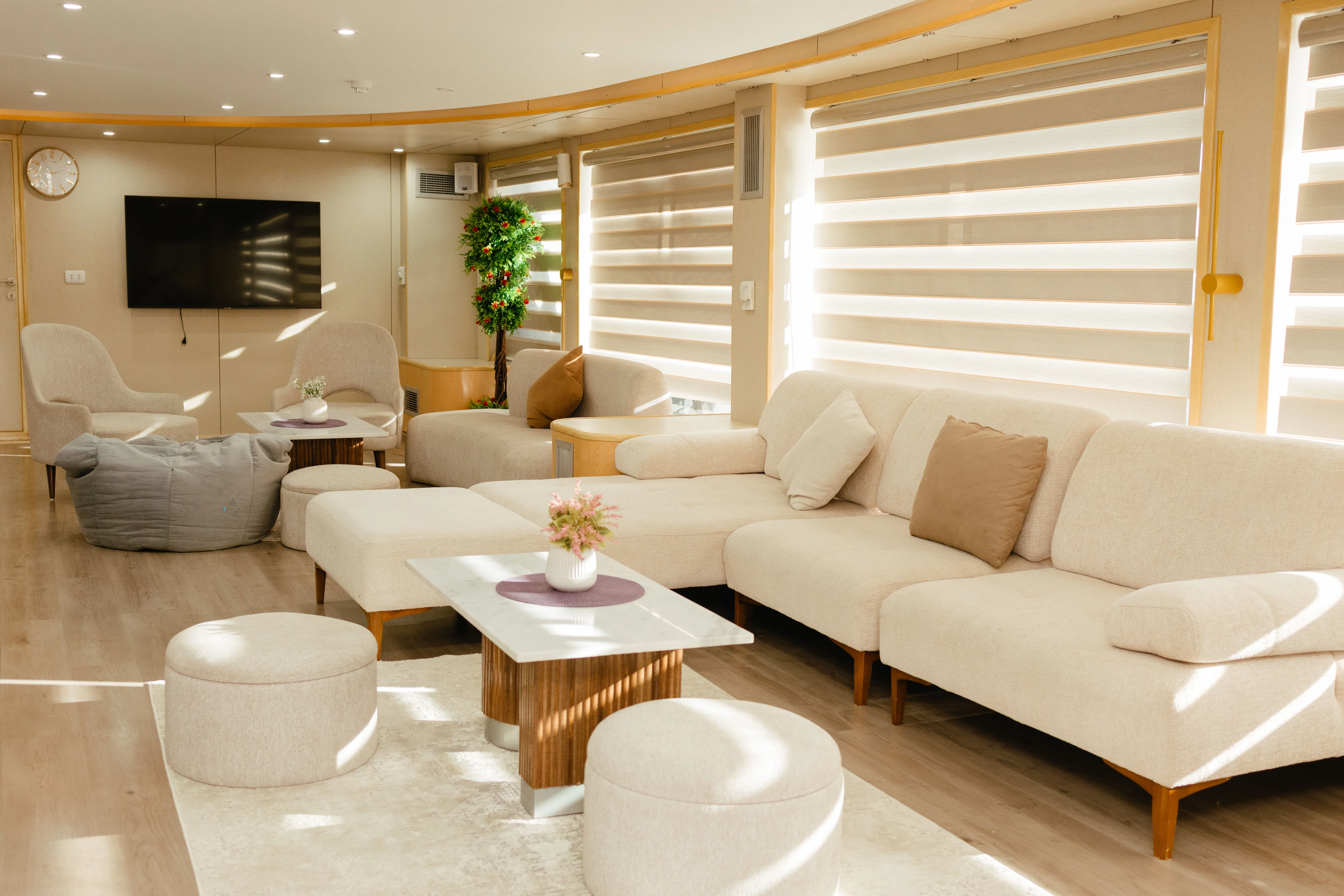 Avo's saloon with panoramic windows and soft seating