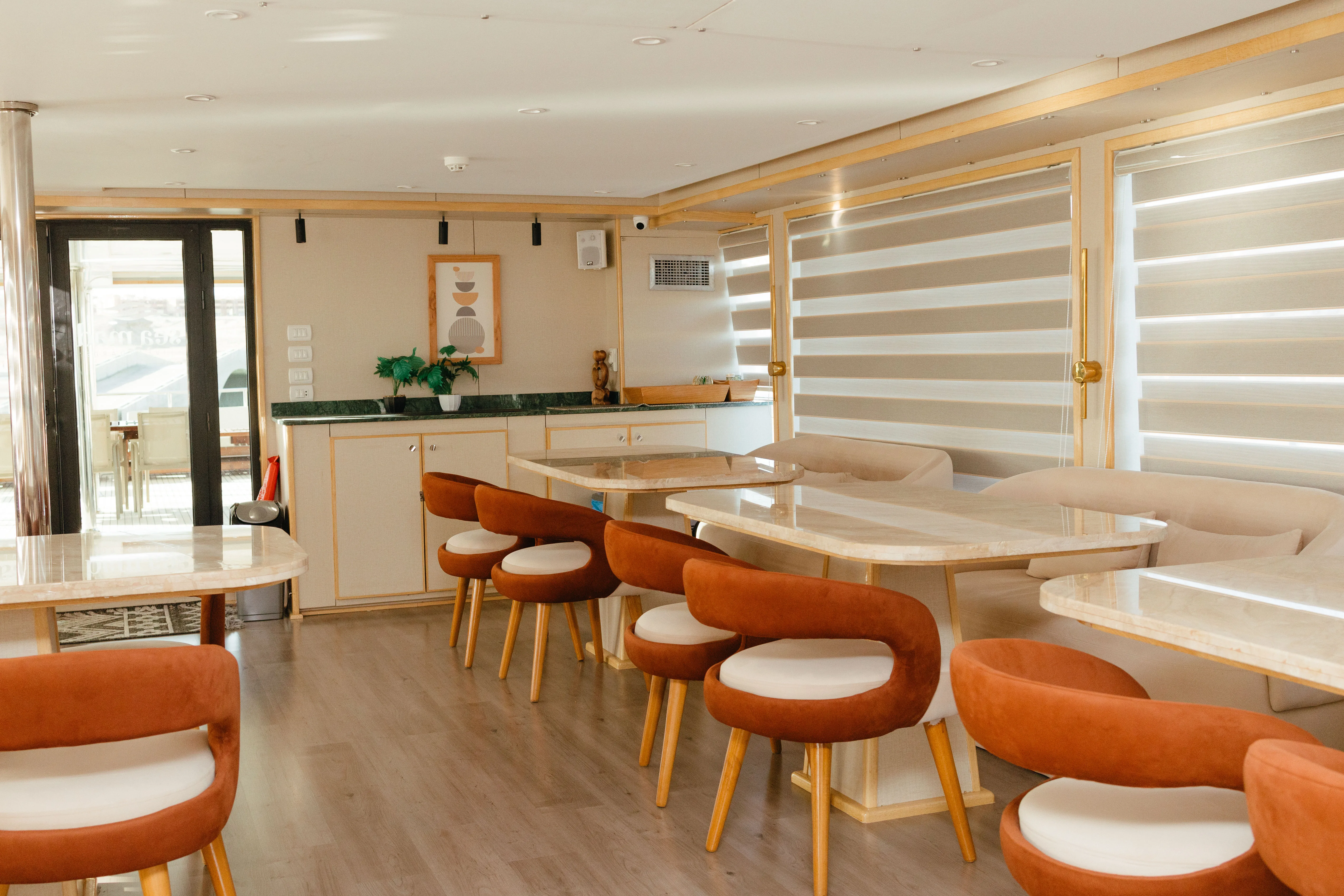 Avo's restaurant — long table and upholstered chairs