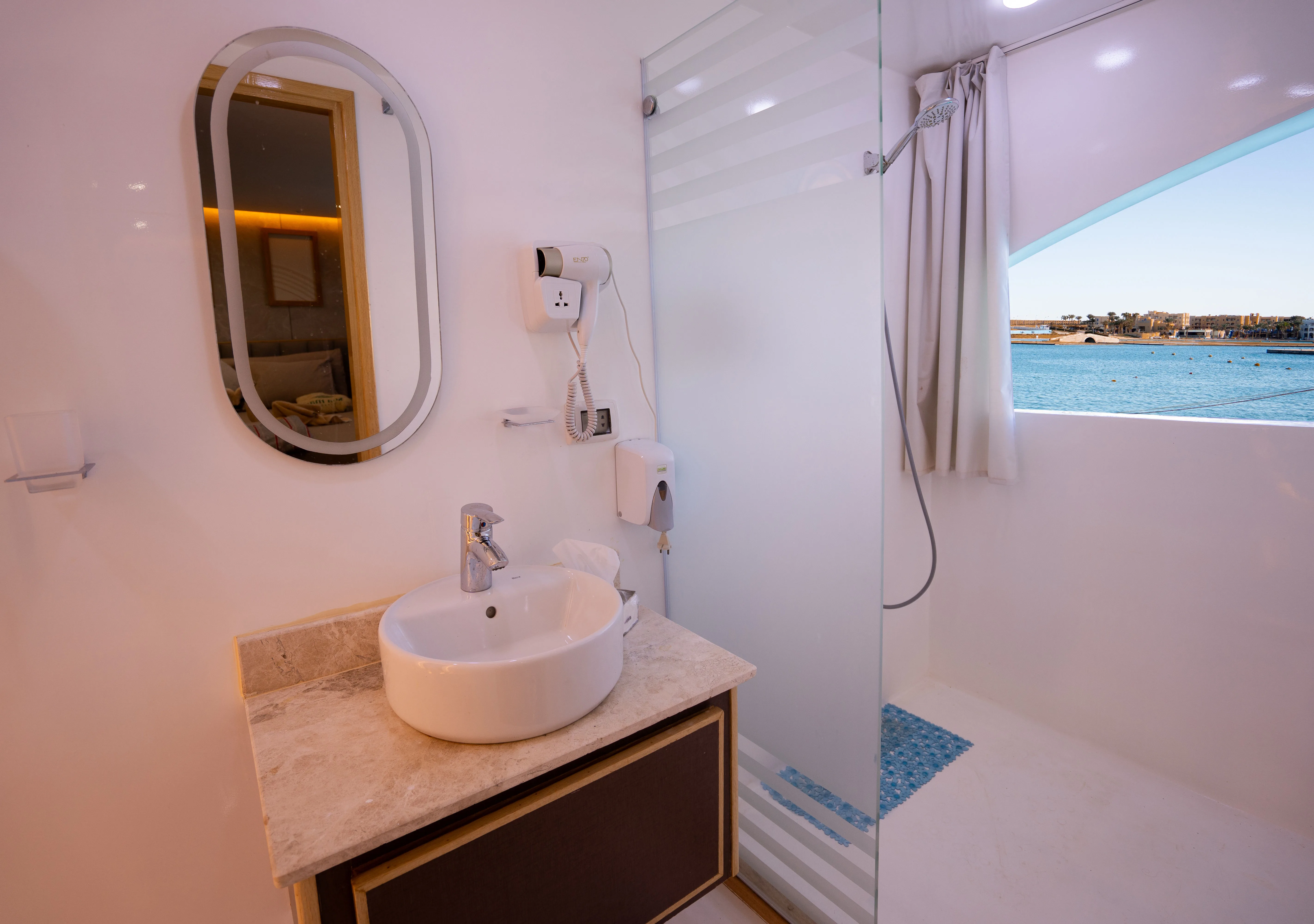 En-suite bathroom of a premium cabin on Avo — shower and basin