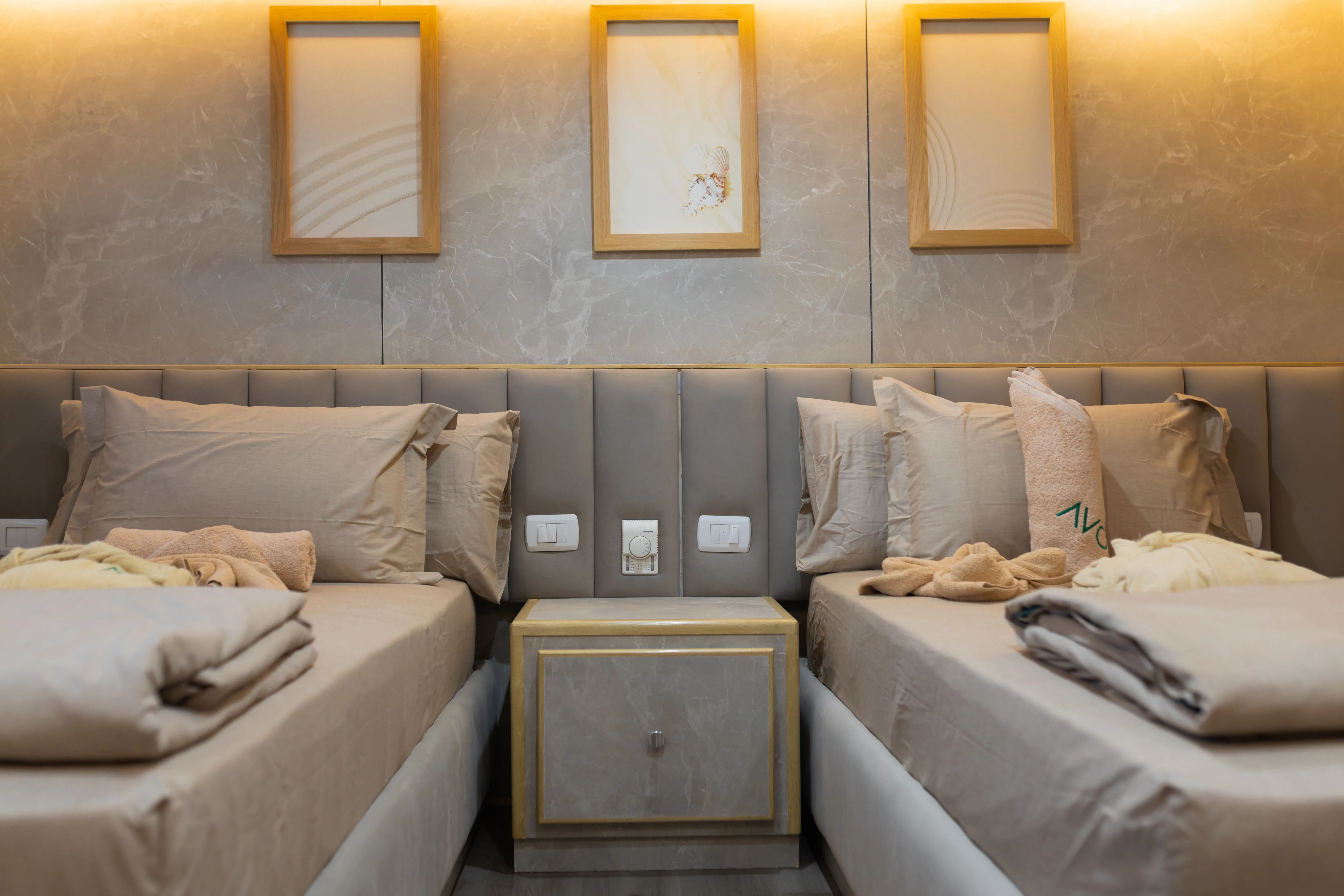 Headboards and bedside cabinet in a premium cabin on Avo