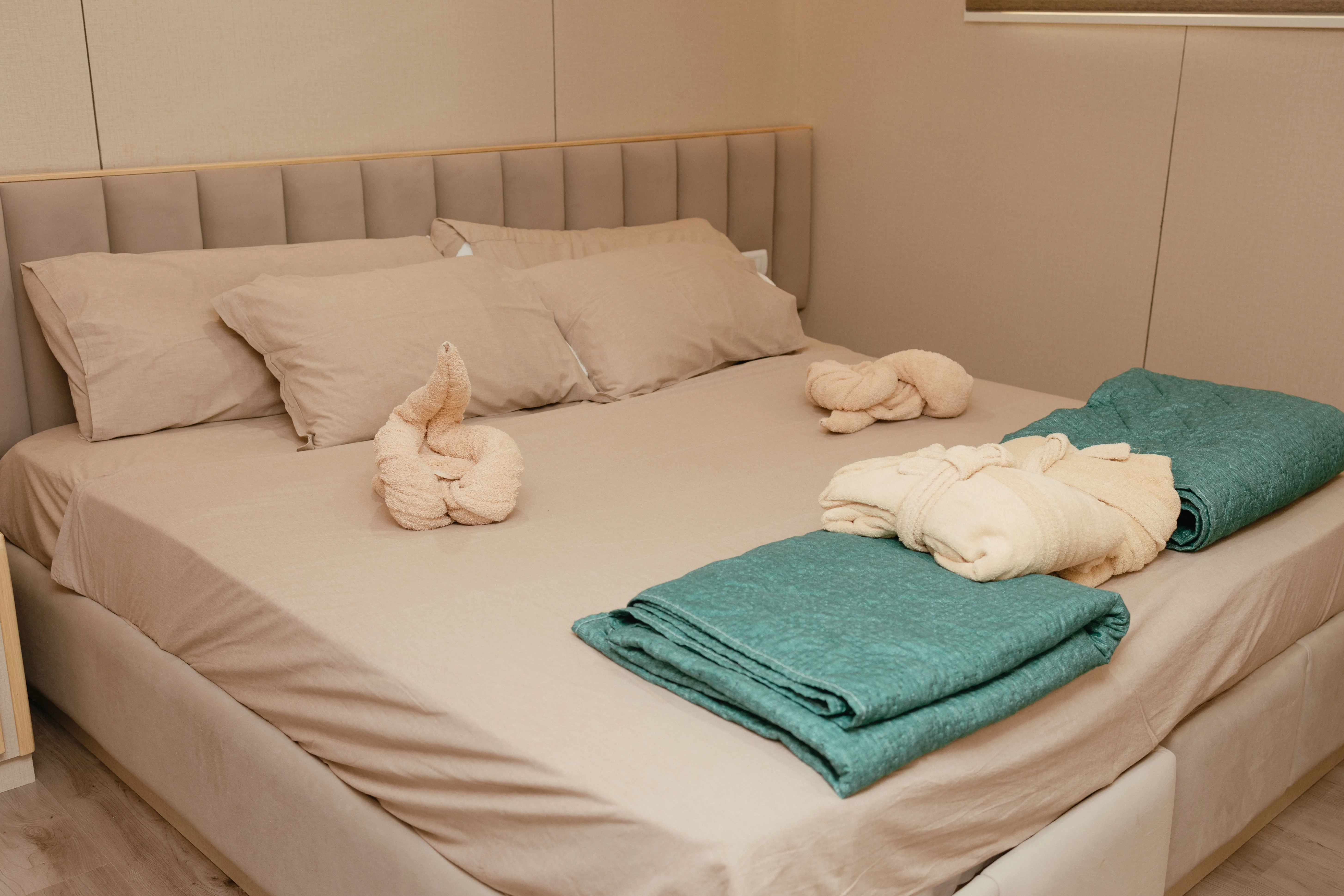 Made-up double bed in a standard cabin on Avo